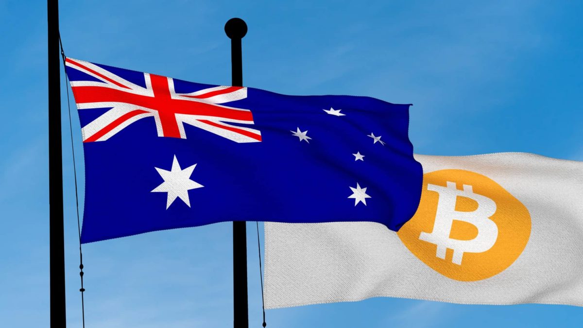 An Australian flag flies next to a flag showing Bitcoin.