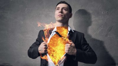 Concept image of a man in a suit with his chest on fire.