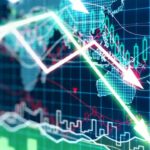 A bright graphic showing neon green and red arrows in a downwards direction with a world map behind them in neon blue