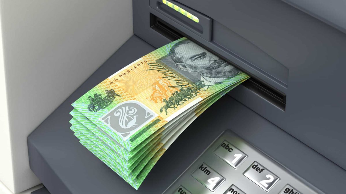 ATM with Australian hundred dollar notes hanging out.