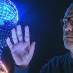 A man touches an AI light version of a brain