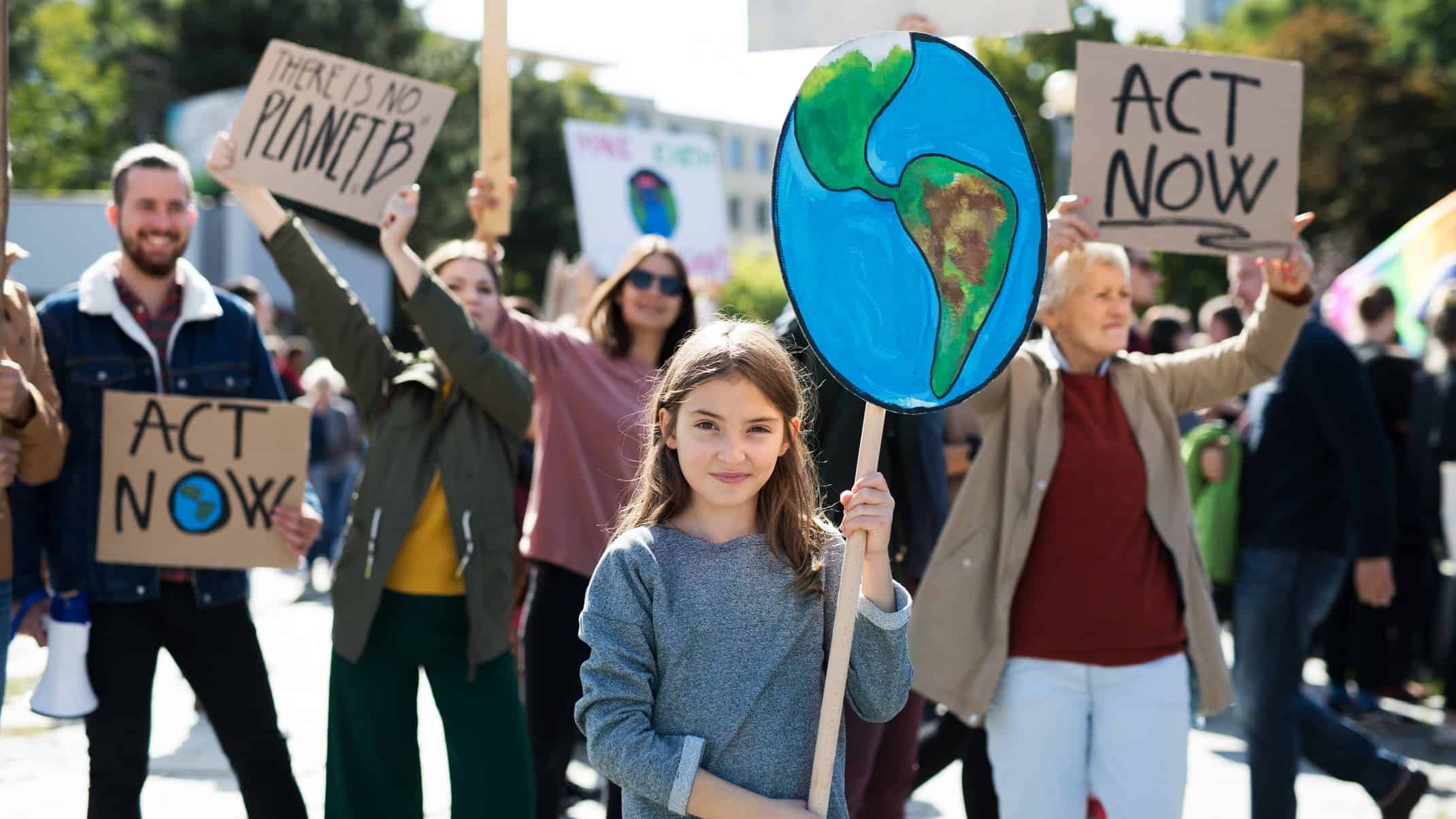People protesting to act on climate change.