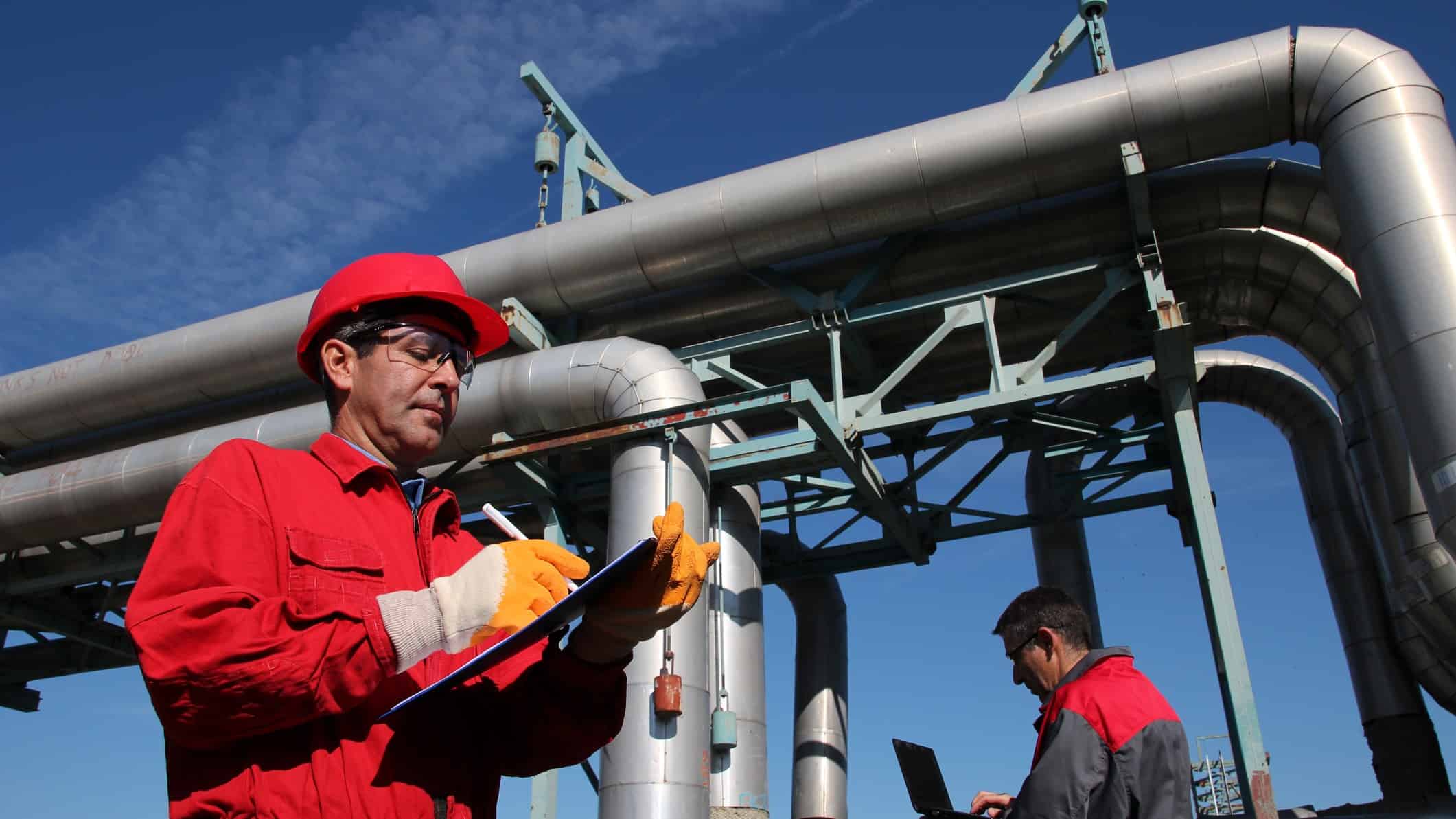 Workers inspecting a gas pipeline.