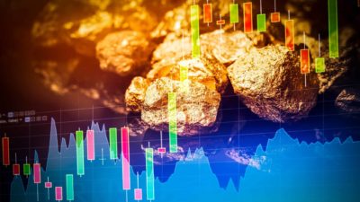 Gold nuggets with a share price chart.