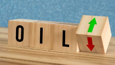 Oil spelt out on block cubes with an up and down arrow.