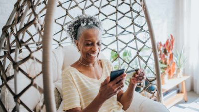 Happy woman using a BNPL service.