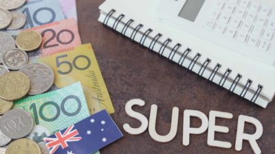 Australian notes and coins surrounded by a calculator and the word super spelt out.