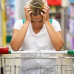 Sad person at a supermarket.