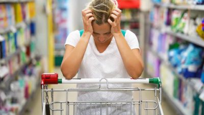 Sad person at a supermarket.