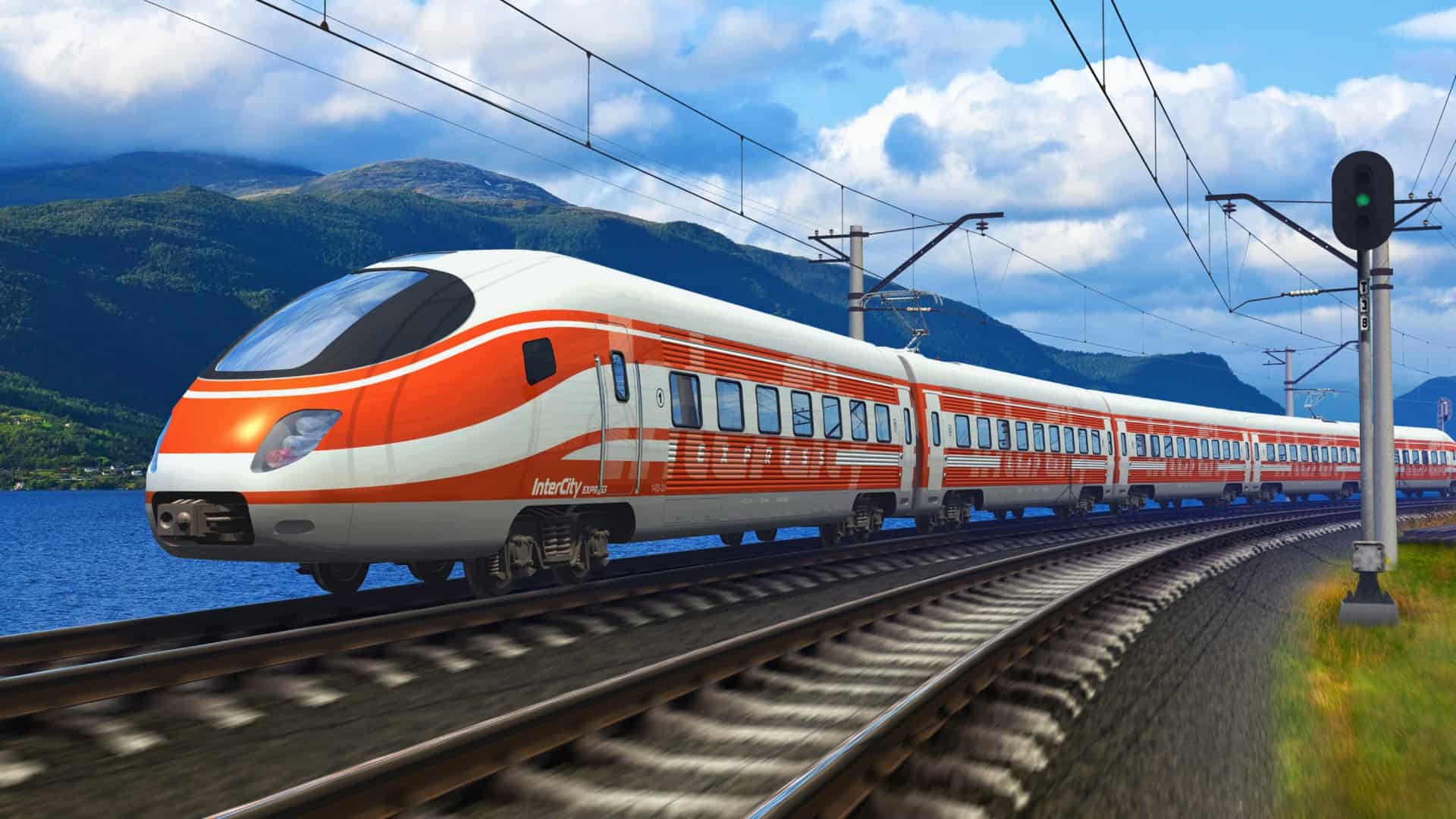 high speed train on a track with mountains in the background.