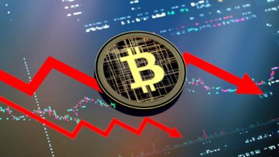 A graphic showing a bitcoin in the centre and red arrows behind it pointing downwards