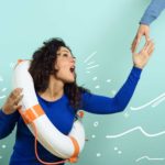 A woman wearing a lifebuoy ring reaches up for help as an arm comes down to rescue her.