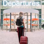 Woman at a departure terminal at an airport.