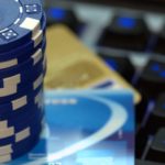 Blue chips on credit cards and a keyboard.
