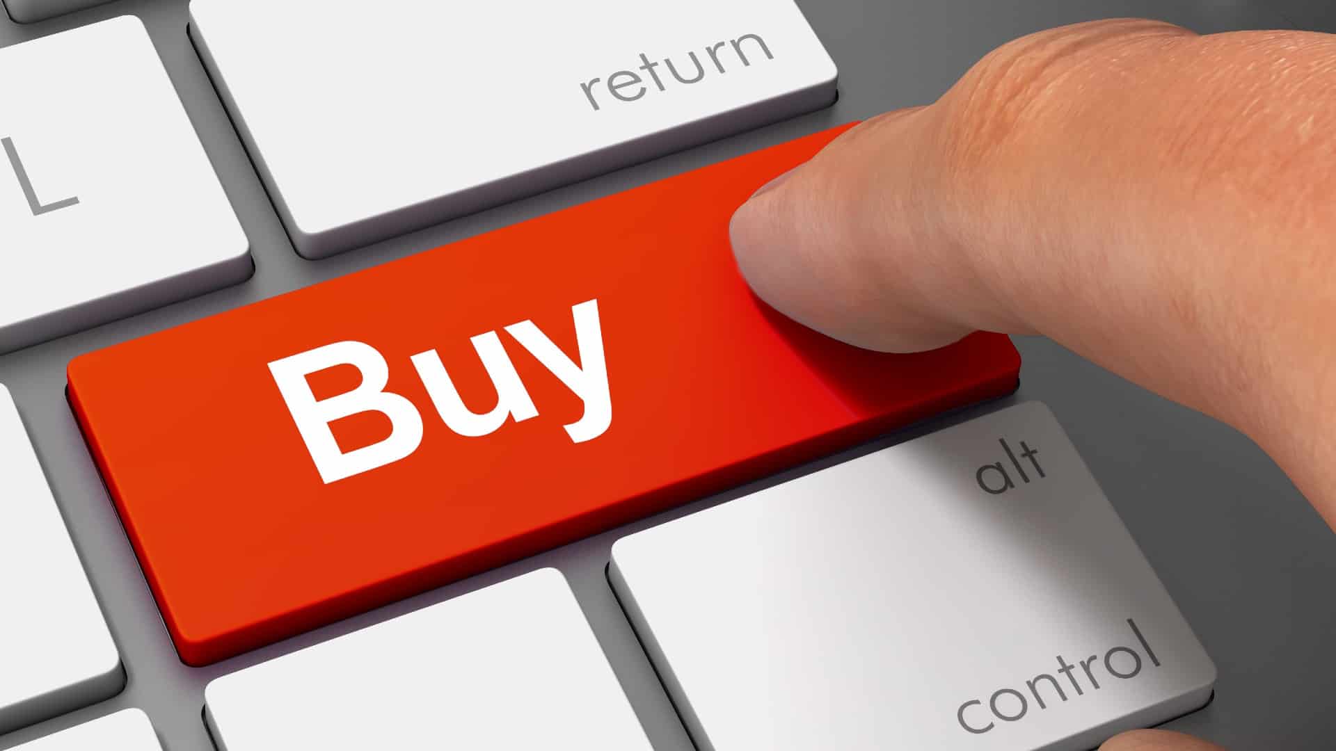 Red buy button on an apple keyboard with a finger on it representing asx tech shares to buy today