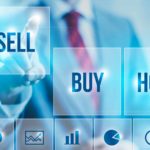 Sell buy and hold on a digital screen with a man pointing at the sell square.