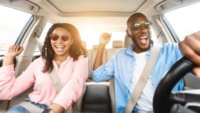 Happy couple in a car.