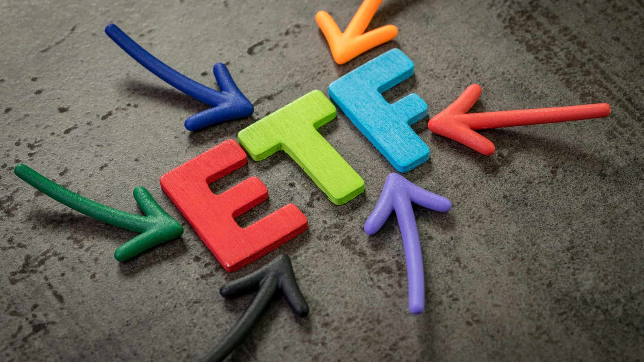 ETF in written in different colours with different colour arrows pointing to it.