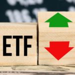 ETF on a cube with a green and red arrow on another cube.