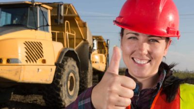 Happy woman miner with her thumb up signalling Wyloo's commitment to back IGO's takeover of Western Areas nickel