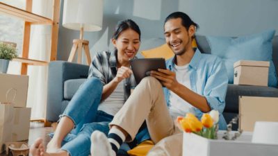 Happy couple doing online shopping.