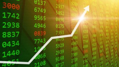 Green stock market graph with a rising arrow symbolising a rising share price.