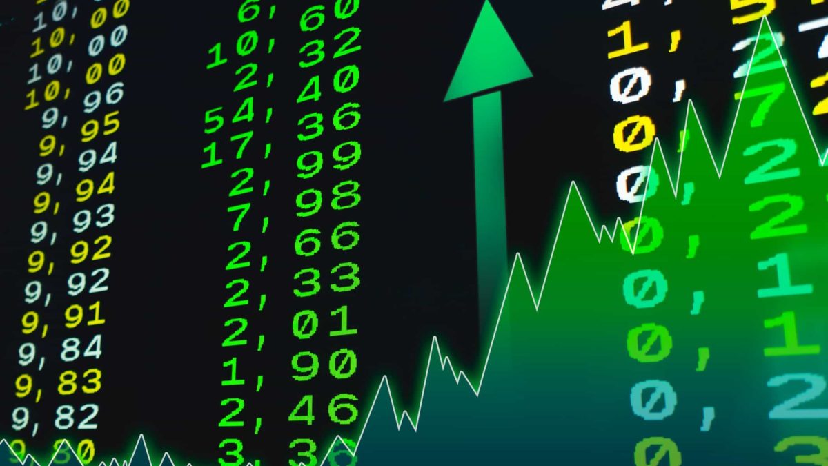 Stock market chart in green with a rising arrow symbolising a rising share price.