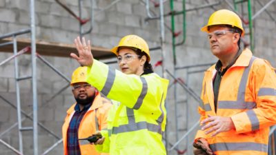 Miner putting out her hand symbolising a share price trading halt.