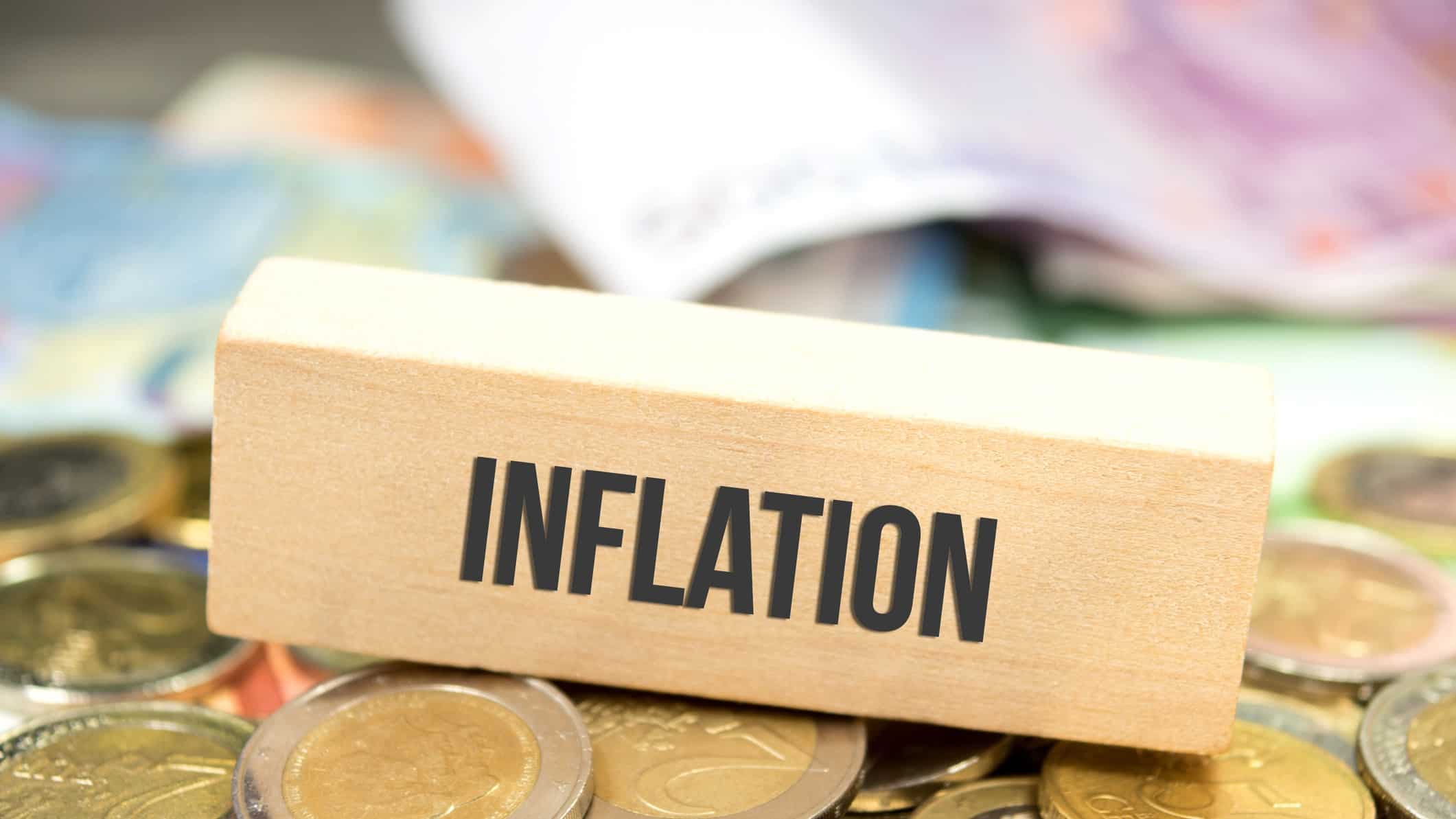 Inflation written in black on a wooden rectangle.
