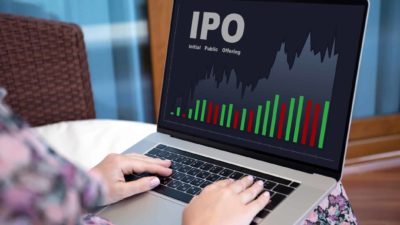 IPO spelt out on a laptop with a red and green bar chart underneath.
