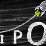 IPO written on a chalk board with a rising rocket.