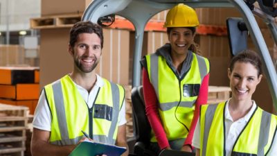 Three workers smiling.