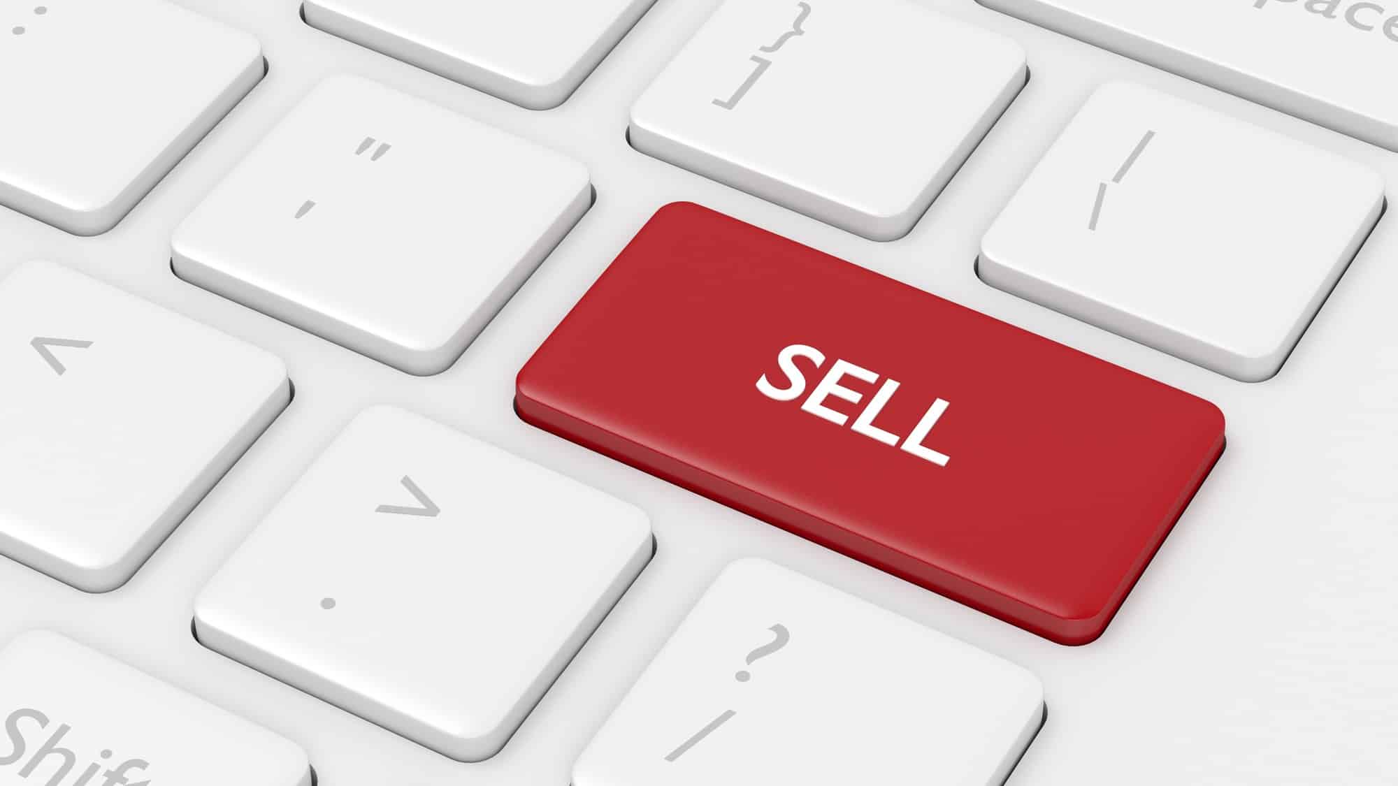 Red sell button on an Apple keyboard.