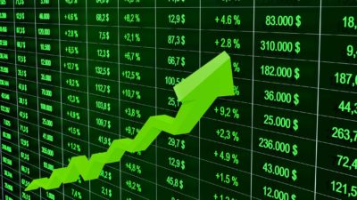 Green arrow with green stock prices symbolising a rising share price.