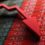 Red arrow going down on a chart, symbolising a falling share price.