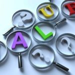 Value spelt out in different colours with magnifying glasses.