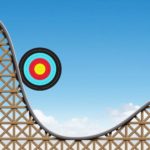Target circle going down on a rollercoaster, symbolising volatility.