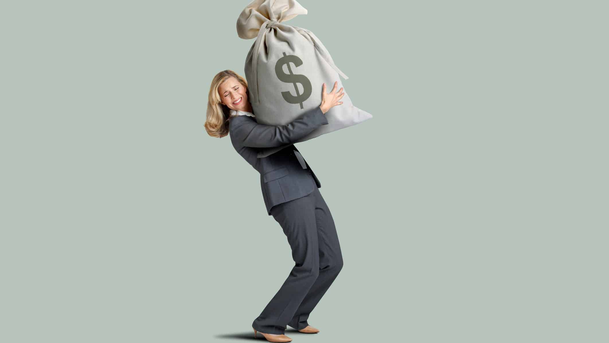 a woman struggles under the weight of a large bag of cash.