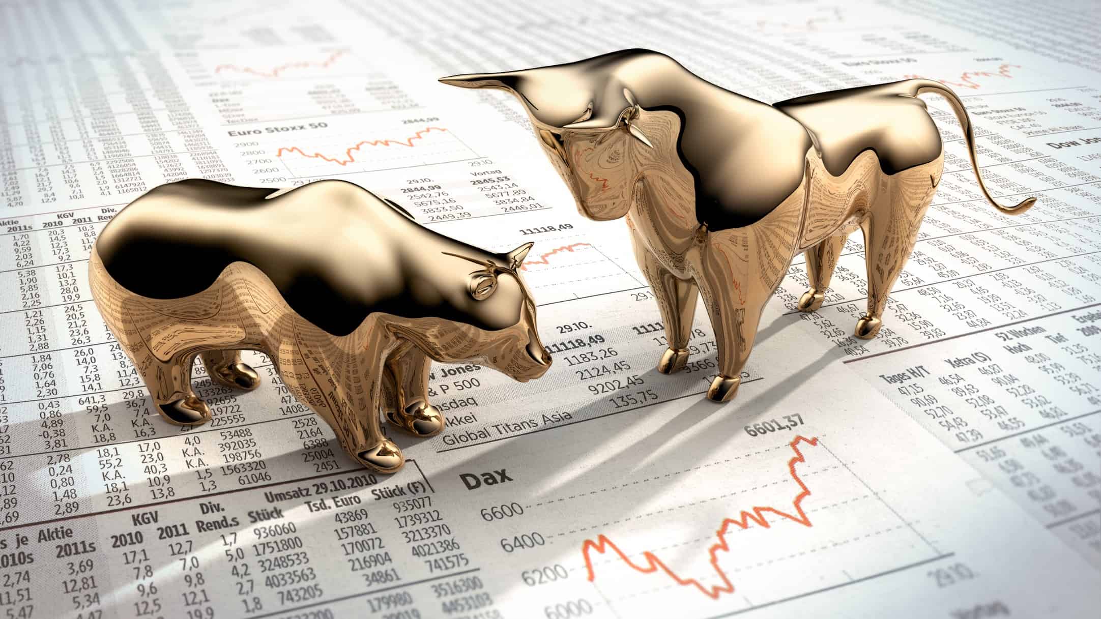 A gold bear and bull face off on a share market chart
