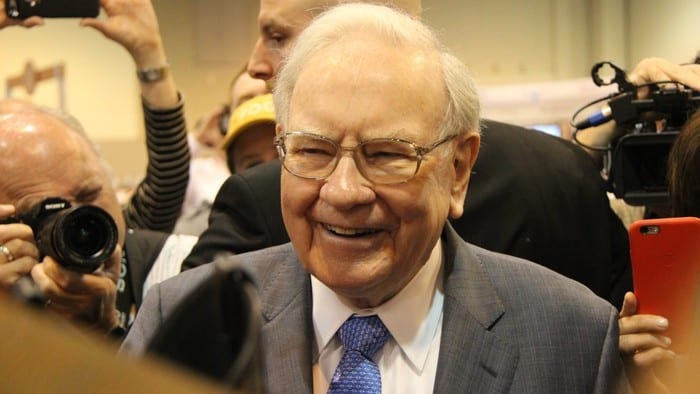 a smiling picture of legendary US investment guru Warren Buffett.