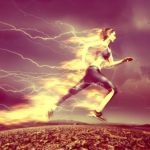 A woman sprints with a trail of fire blazing from her body.