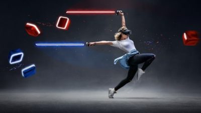 a woman in athletic wear holds two long bright swords of red and blue in either hand while leaping mid-air to face flying squares that come for her also in red and blue as though she is playing a game in virtual reality.