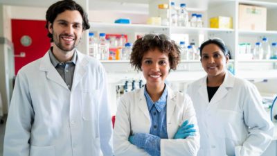 Happy healthcare workers in a labs