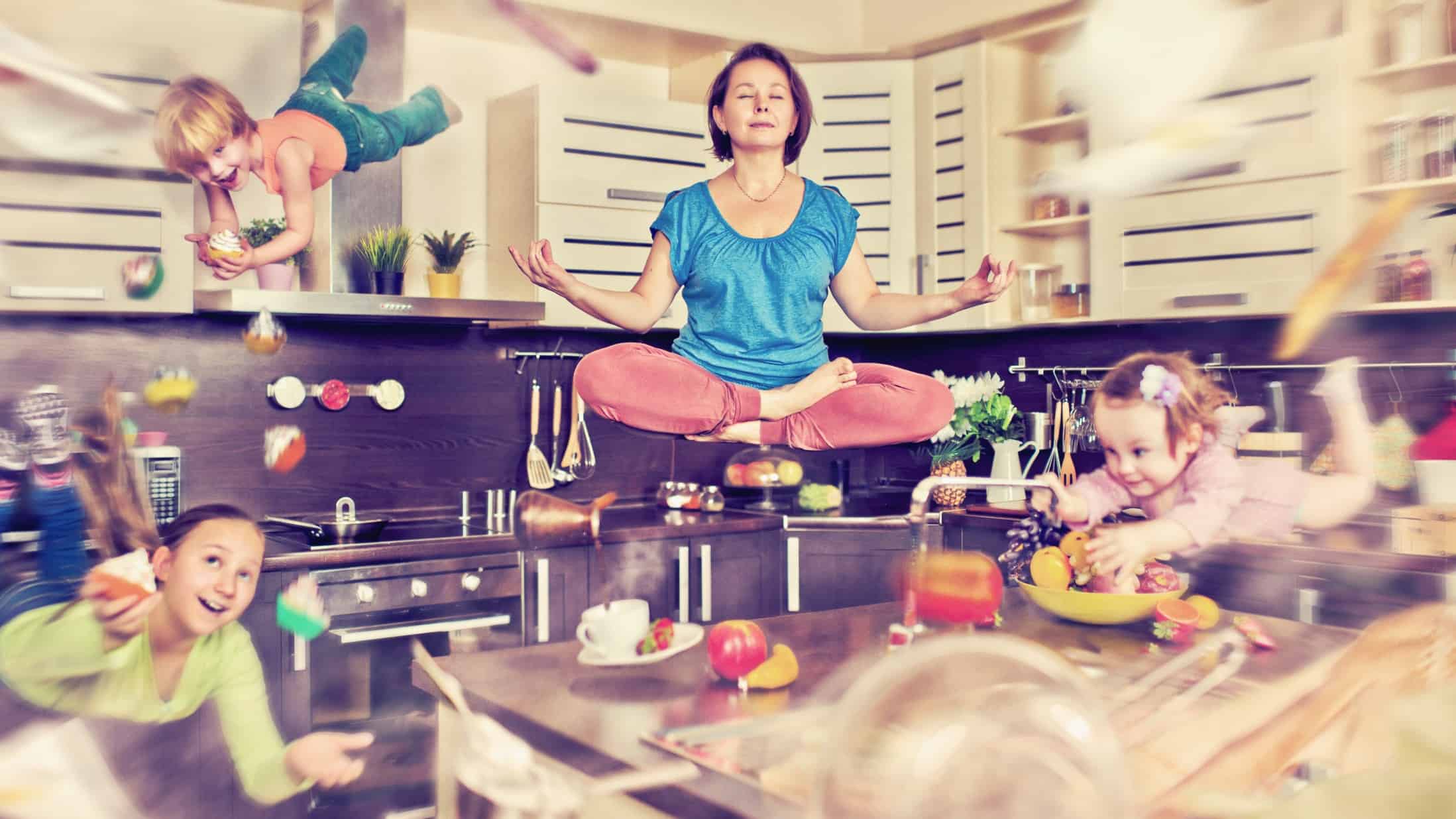 A mum levitates in a state of calm above the kitchen in her home, while the busyness and noise of kids, food and the chaos of everyday living whirls around her.