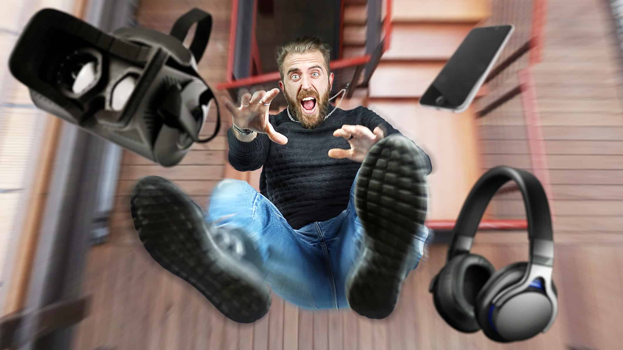 A man yells as his virtual reality headset and earphones tumble to the floor.