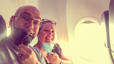 It's smiles all around as this couple take a selfie in their seats as their plane takes off and they travel overseas.