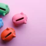 Different colour piggy banks symbolising diversification.