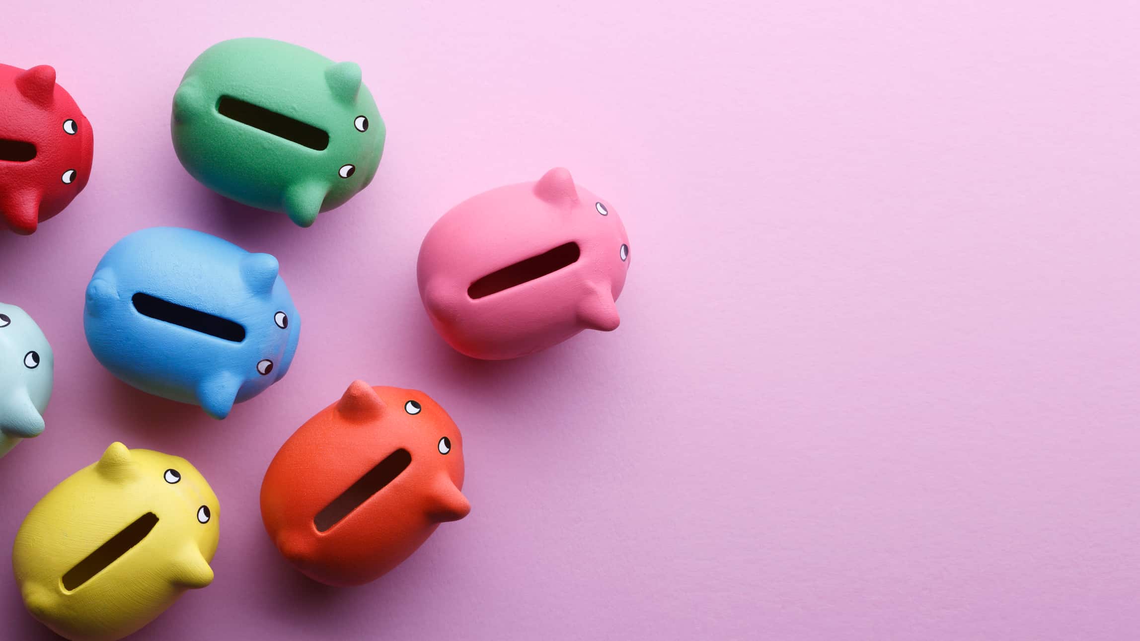 Different colour piggy banks symbolising diversification.