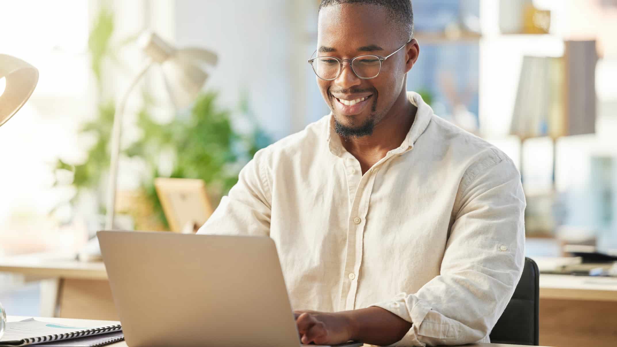 Happy man working on his laptop.