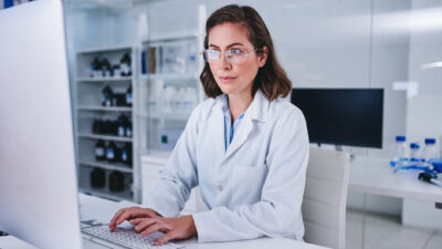 Shot of a scientist using a computer while conducting research in a laboratory.